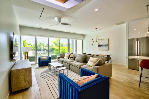 a living room with a couch and a table at ONE Canal Point in Upper Land