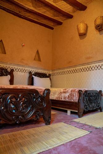 Un ou plusieurs lits dans un hébergement de l'établissement Maison etoile du desert