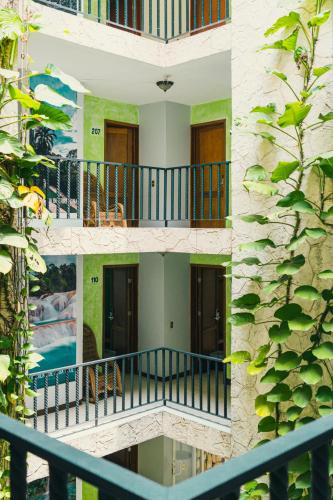 an external view of a building with balconies at Hotel Cañada Internacional in Palenque