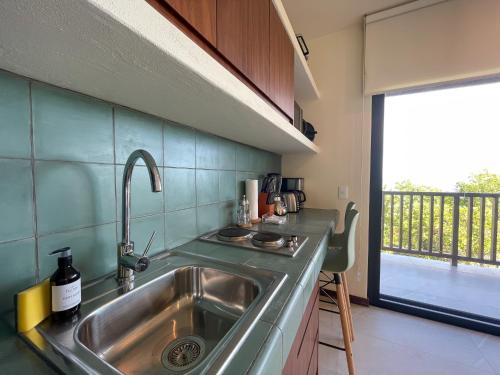 Kuchyň nebo kuchyňský kout v ubytování Ocean View Loft in Punta Cocos - D102