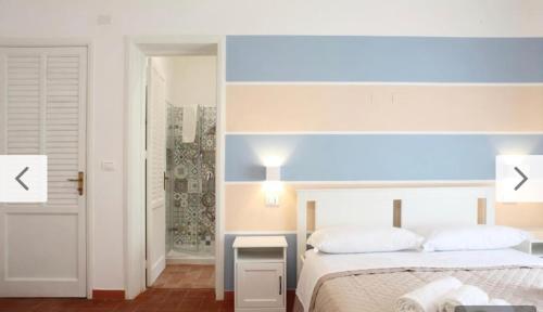 a hotel room with two beds and a window at Villa San Vito Bay in Macari