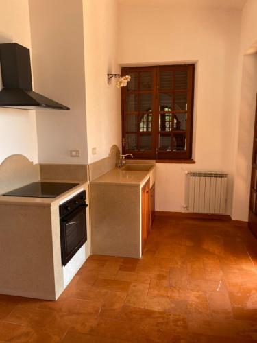 a kitchen with a sink and a stove at Villa San Vito Bay in Macari