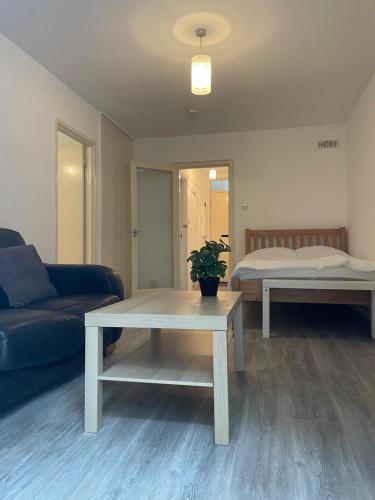 a living room with a couch and a table at Central London Serviced Apartment near Borough station SE1 in London