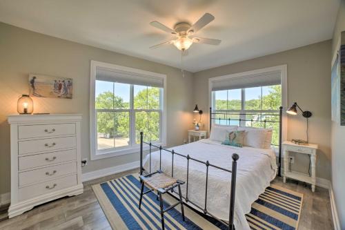 a bedroom with a bed and a ceiling fan at Bright and Airy Home Chefs Kitchen and Pro Decor! in Michigan City