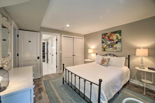 a bedroom with a bed and a bathroom at Bright and Airy Home Chefs Kitchen and Pro Decor! in Michigan City
