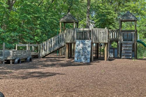 a wooden playground in a park with a slide at Bright and Airy Home Chefs Kitchen and Pro Decor! in Michigan City
