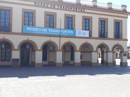 a building with a sign that reads museo de transformations at Real .Departamento in Luján