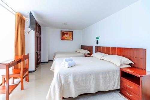 Postel nebo postele na pokoji v ubytování Juan Sebastián Hotel