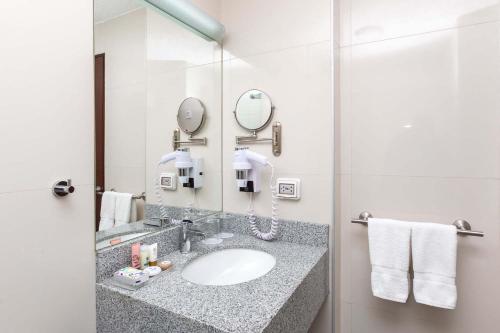 a bathroom with a sink and a mirror at Casa Andina Select Arequipa Plaza in Arequipa