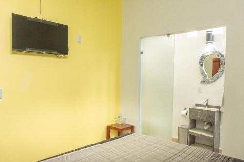 TV a/nebo společenská místnost v ubytování CASA ANTARES