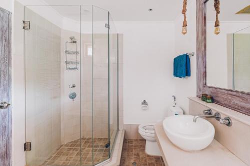 a bathroom with a shower and a sink and a toilet at Beachfront Art Villa Samui in Bophut 