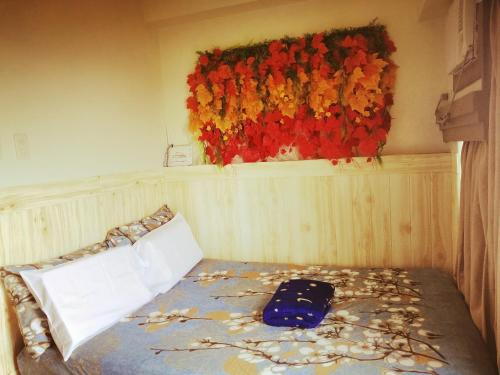 Un ou plusieurs lits dans un hébergement de l'établissement Evelyn's Place at Tagaytay 2