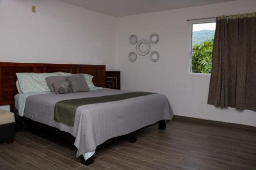 Postel nebo postele na pokoji v ubytování Hotel Garden Suites Tonalá