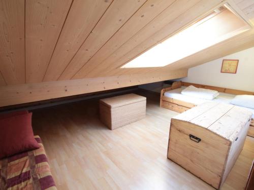 a attic room with two beds and a skylight at Appartement Les Carroz d'Arâches, 2 pièces, 4 personnes - FR-1-572-259 in Arâches-la-Frasse