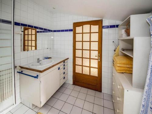 a white bathroom with a sink and a mirror at PARIS COTTAGE MONT VALERIEN - HEIGHTS OF PARIS in Suresnes
