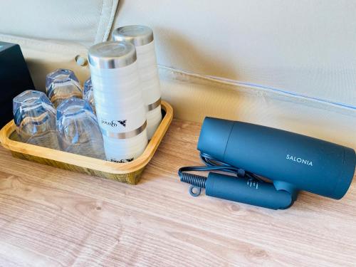 a blue inhaler sitting on a table next to a box of bottles at 8POINT RESORT Okinawa in Nanjo