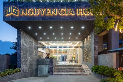 a hotel entrance with a sign that reads ukoxyven gala hotel at Nguyen Gia Hotel in Da Nang