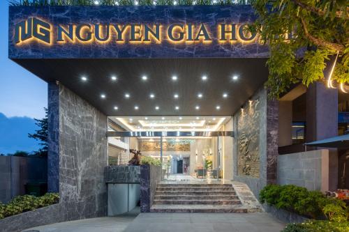 a hotel entrance with a sign that reads ukoxyven gala hotel at Nguyen Gia Hotel in Danang