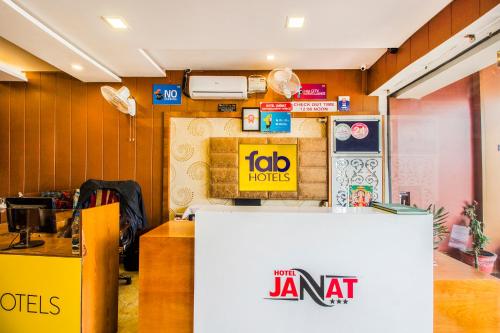 a room with a janaat sign on the wall at FabHotel Jannat Zirakpur in Zirakpur