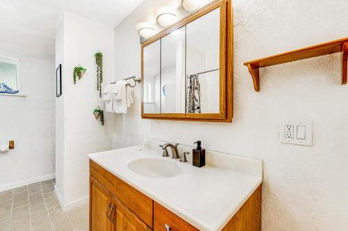 a bathroom with a sink and a mirror at Summit House in Guerneville