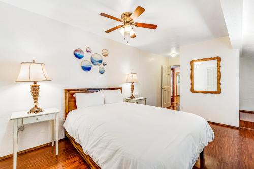 a bedroom with a bed and a ceiling fan at Summit House in Guerneville