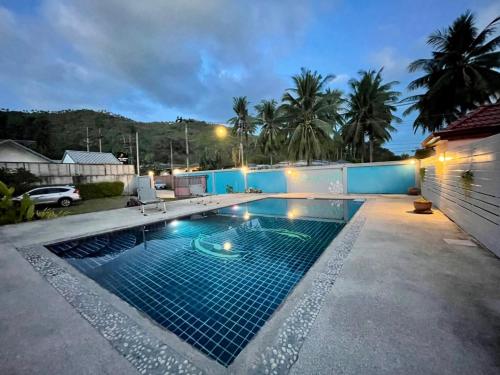 a swimming pool in the middle of a yard at Shine of Hill Lamai Koh Samui in Lamai