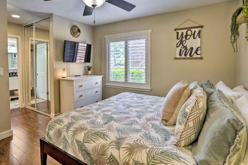 a bedroom with a bed and a dresser and a mirror at Stylish Dana Point Getaway 1 Mi to Beach! in Dana Point