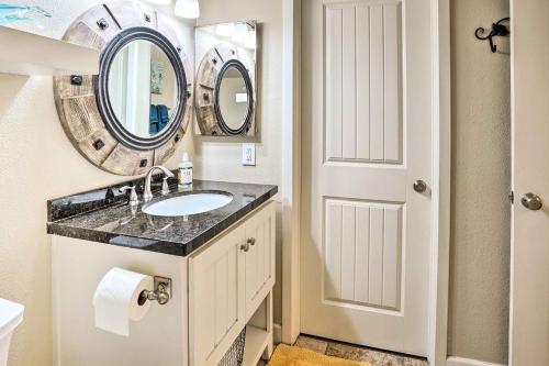 a bathroom with a sink and a mirror at Stylish Dana Point Getaway 1 Mi to Beach! in Dana Point