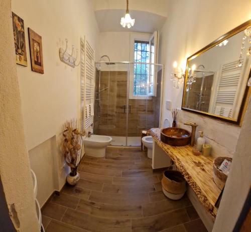 a bathroom with a sink and a toilet and a shower at Bologna Minimal Chic House Relax Parking Nature Near Center in Bologna