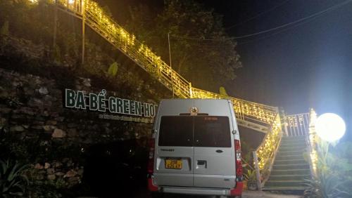 a white van parked next to a staircase at night at Ba Bể Green (View Ba Be lake) in Bak Kan