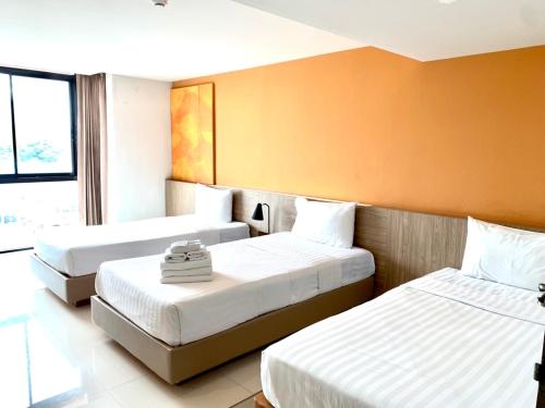 Postel nebo postele na pokoji v ubytování ABIZZ Hotel Lampang Airport