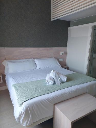 Ένα ή περισσότερα κρεβάτια σε δωμάτιο στο Hotel Tematico Do Banco Azul