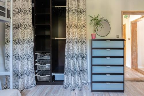 a bedroom with a dresser and a closet at SopotSpanie in Sopot