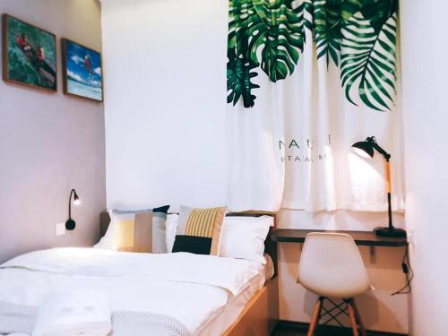 Ένα ή περισσότερα κρεβάτια σε δωμάτιο στο Infinity Guesthouse