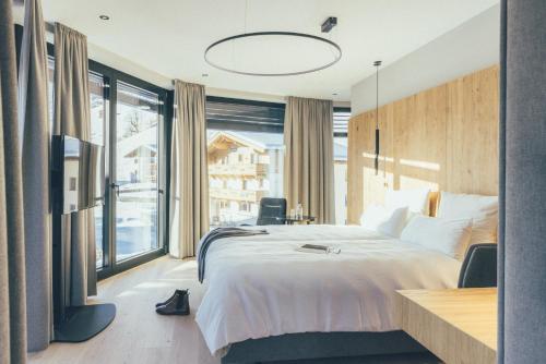 Postel nebo postele na pokoji v ubytování DAS GERLOS - Boutique Hotel