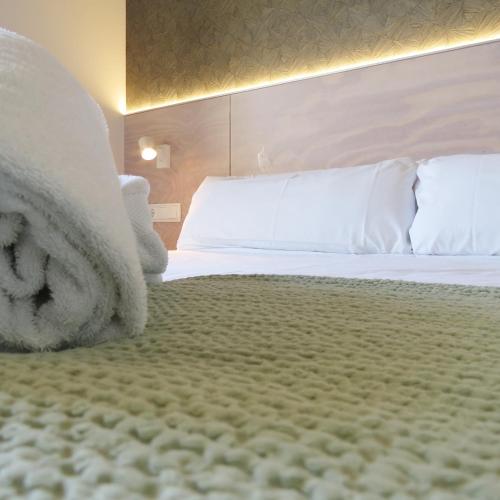 Ένα ή περισσότερα κρεβάτια σε δωμάτιο στο Hotel Tematico Do Banco Azul