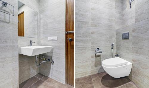 a bathroom with a toilet and a sink at Treebo Purple Orchid Boutique in Bengaluru