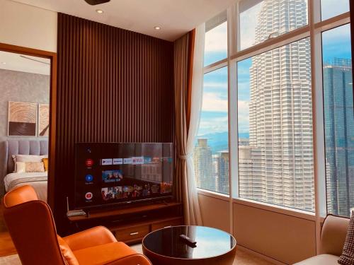 a hotel room with a view of a large window at De Sky Suites KLCC Kuala Lumpur in Kuala Lumpur