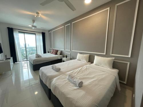 Katil atau katil-katil dalam bilik di Teega Suites PuteriHarbour By WP Homestay