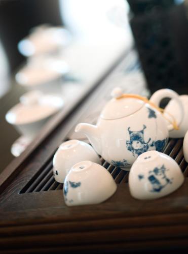 a group of teapots sitting on a table at Wanda Reign Resort & Villas Sanya Haitang Bay in Sanya