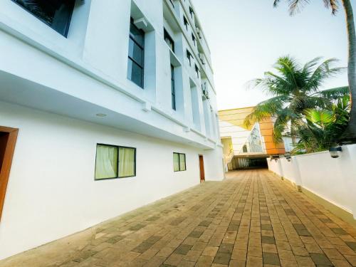 an empty street in front of a building at Green Park Residency in Kannur