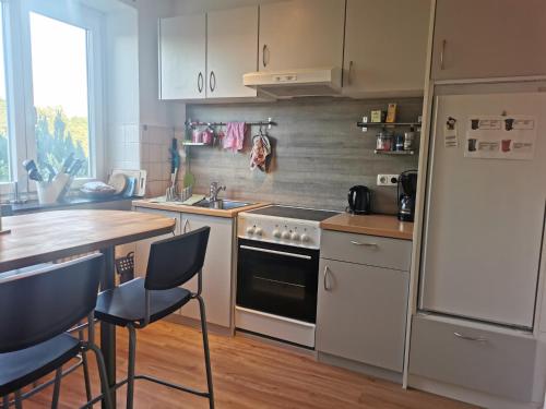 a kitchen with a sink and a stove top oven at Gemütliche Gästewohnung in ruhiger Lage in Kronshagen