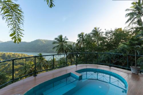 a view from the balcony of a villa with a swimming pool at The Albatross, Kandy in Digana