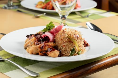 a white plate of food on a table at The Albatross, Kandy in Digana