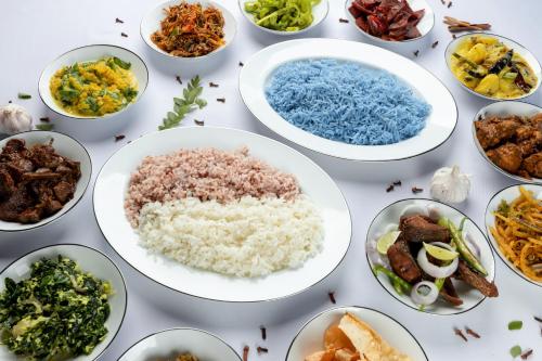 a group of bowls of food on a table at The Albatross, Kandy in Digana