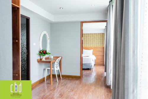 Ένα ή περισσότερα κρεβάτια σε δωμάτιο στο CBD Hotel Suratthani
