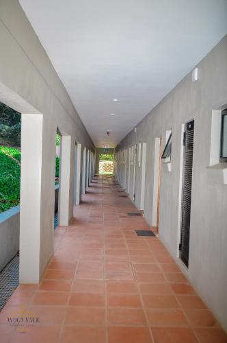 a hallway of a building with a long corridor at Avoca Vale Country Hotel in Louis Trichardt
