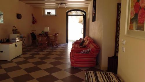 a dog laying on a couch in a living room at Agriturismo MonteMaggio in Lapedona