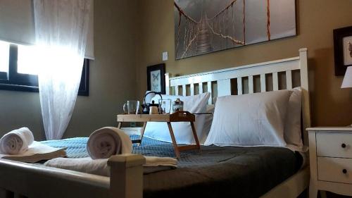 a bedroom with a bed with two dolls on it at Paramount Gardens Resorts C202 in Larnaka