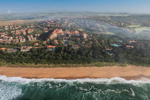 an aerial view of a resort on the beach at The Capital Zimbali in Ballito
